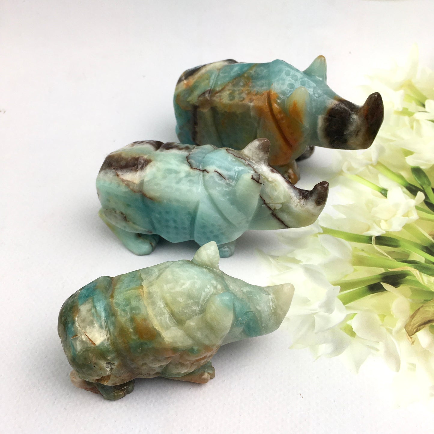 Wholesale Natural Crystal Carved Sculpture Caribbean calcite /fluorite  Rhinoceros and Caribbean calcite penguin